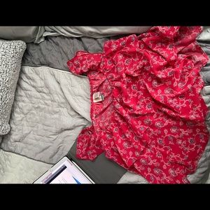 Red blouse with little blue and white flowers